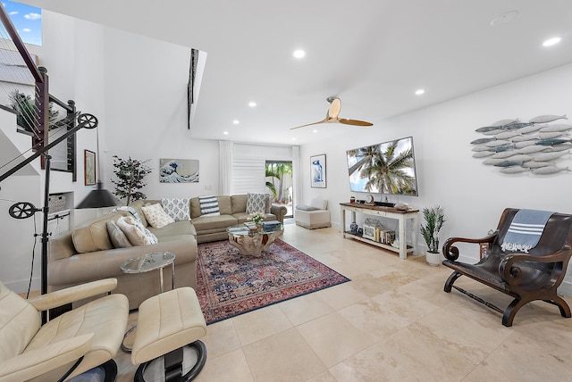 tiled living room featuring ceiling fan