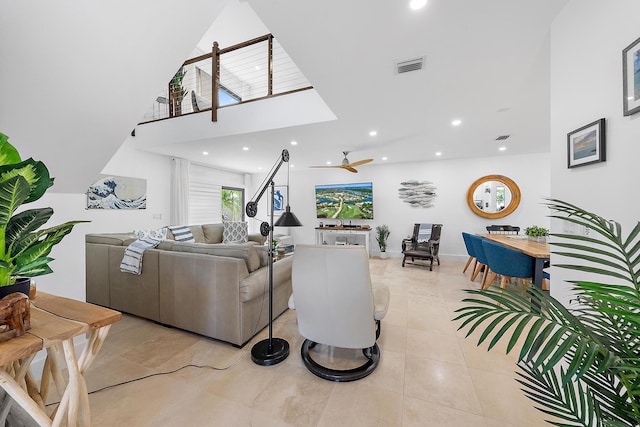 living room featuring ceiling fan and light tile patterned floors