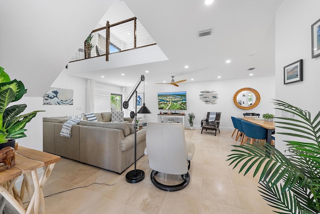 1484 Via Del Sol, Jupiter, FL 33477 - living area with light tile patterned floors, recessed lighting, ceiling fan, and a towering ceiling