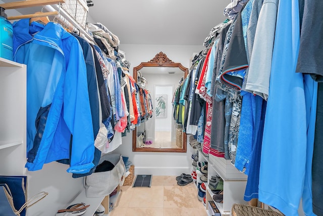 walk in closet featuring tile patterned flooring