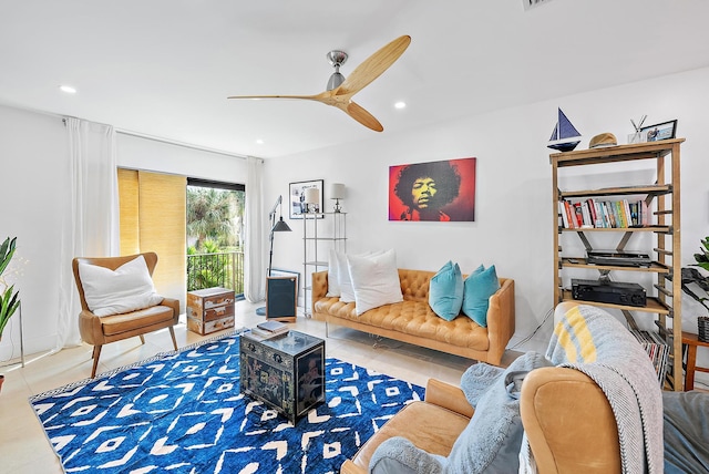 tiled living room with ceiling fan