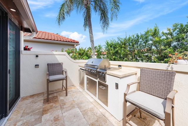 1484 Via Del Sol, Jupiter, FL 33477 - view of patio with an outdoor kitchen