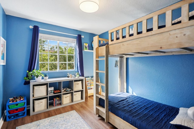 bedroom with wood-type flooring