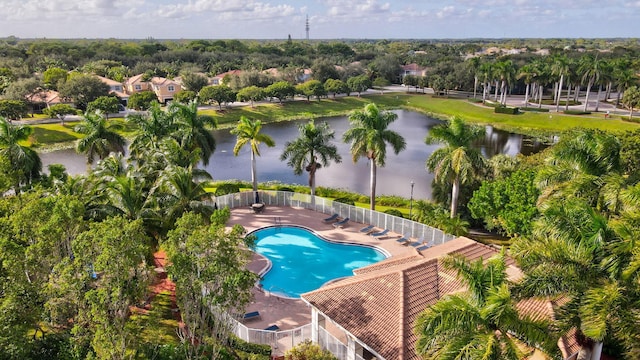 view of swimming pool featuring a patio area and a water view