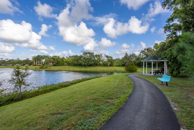 exterior space with a water view, a lawn, and a gazebo