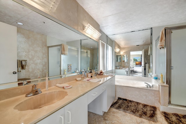 bathroom with tile patterned flooring, vanity, and separate shower and tub