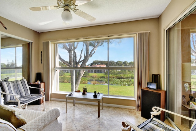 sunroom with ceiling fan and a healthy amount of sunlight