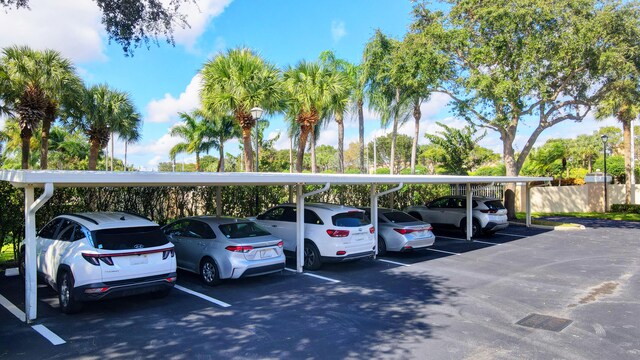 view of parking / parking lot with a carport