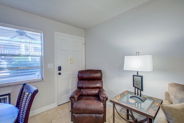 sitting room with light tile patterned floors