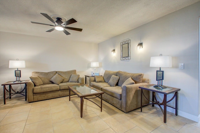 tiled living room with ceiling fan and a textured ceiling