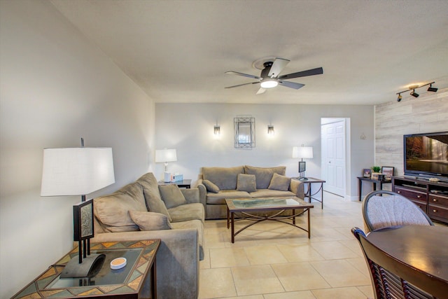 tiled living room featuring ceiling fan and track lighting