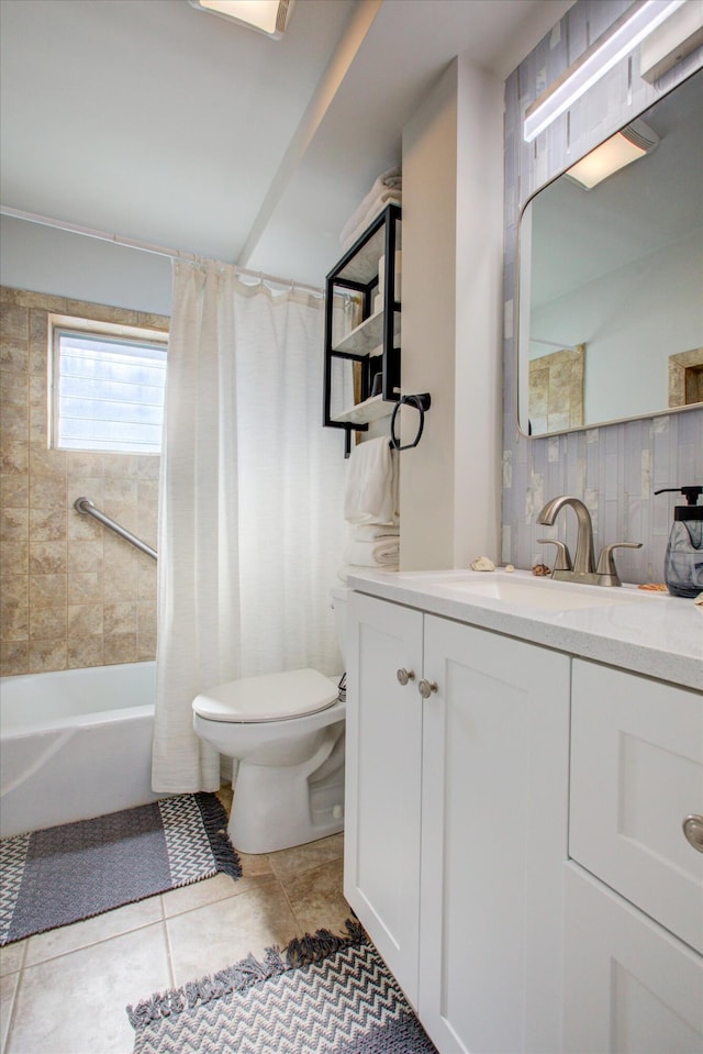 full bathroom featuring tile patterned flooring, vanity, shower / tub combo with curtain, and toilet