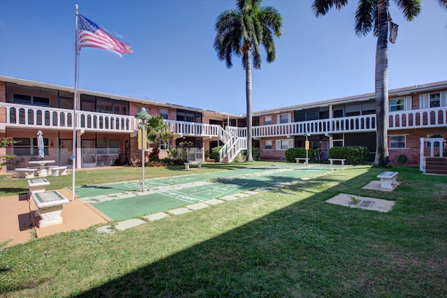 view of community featuring a yard