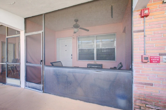 view of patio featuring ceiling fan