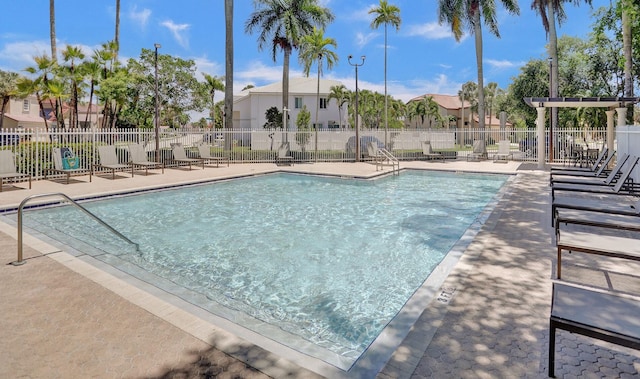 view of swimming pool with a patio area