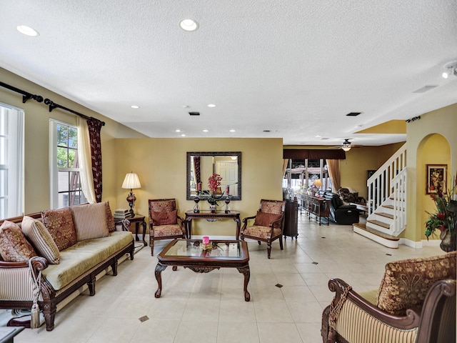 tiled living room with a textured ceiling