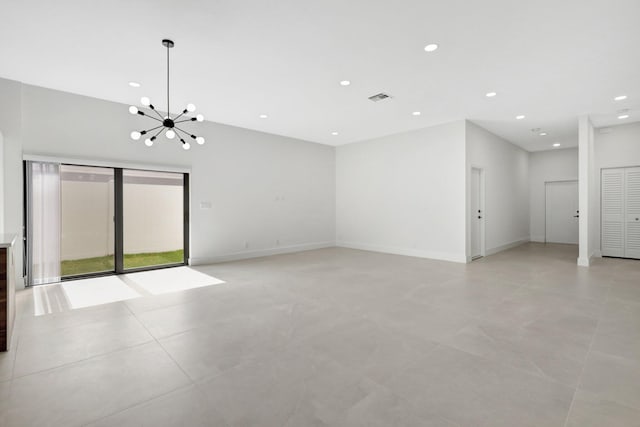 unfurnished room with an inviting chandelier