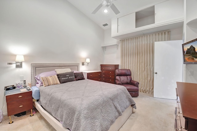 carpeted bedroom with ceiling fan and vaulted ceiling