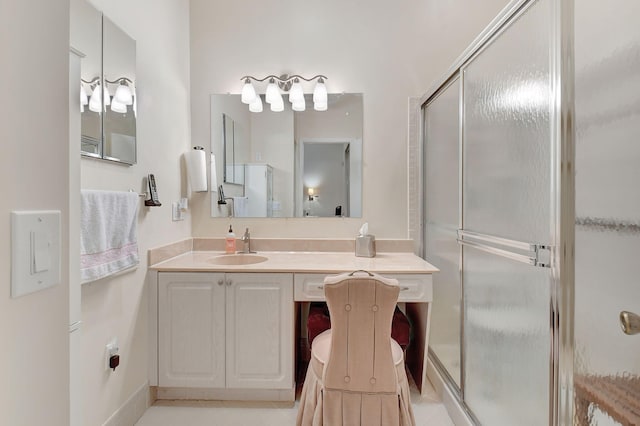 bathroom with tile patterned floors, vanity, and a shower with shower door