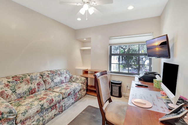 home office featuring ceiling fan and light colored carpet