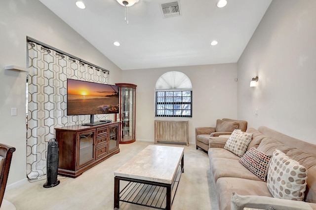 carpeted living room featuring lofted ceiling