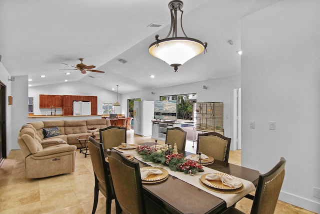 dining area featuring light tile patterned floors, ceiling fan, and lofted ceiling