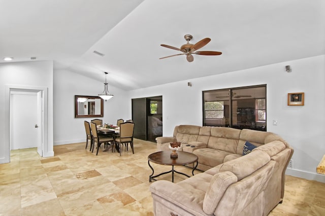 living room featuring ceiling fan and vaulted ceiling