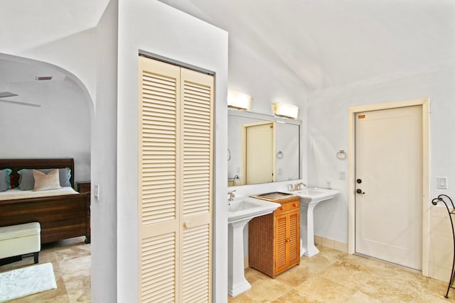 bathroom featuring vaulted ceiling