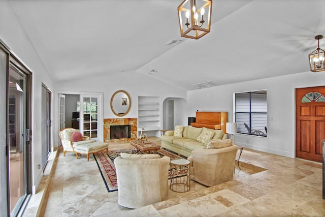 living room with built in features, a chandelier, and lofted ceiling