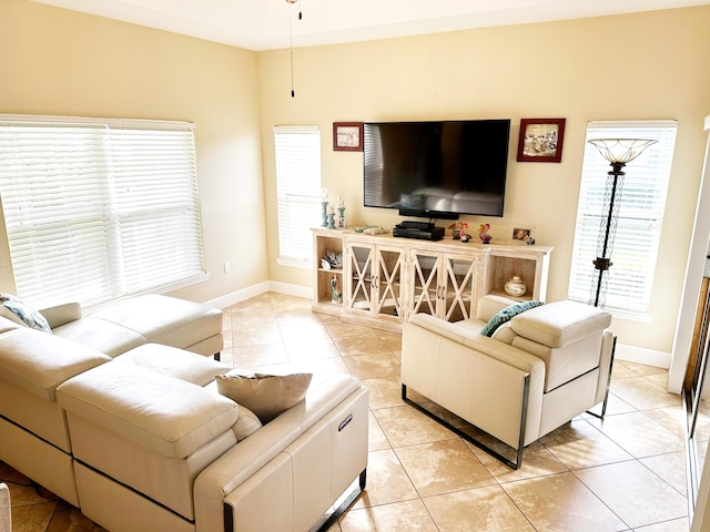 living room featuring a healthy amount of sunlight and light tile patterned floors