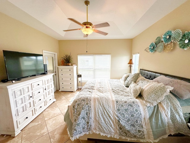 bedroom featuring ceiling fan and light tile patterned flooring