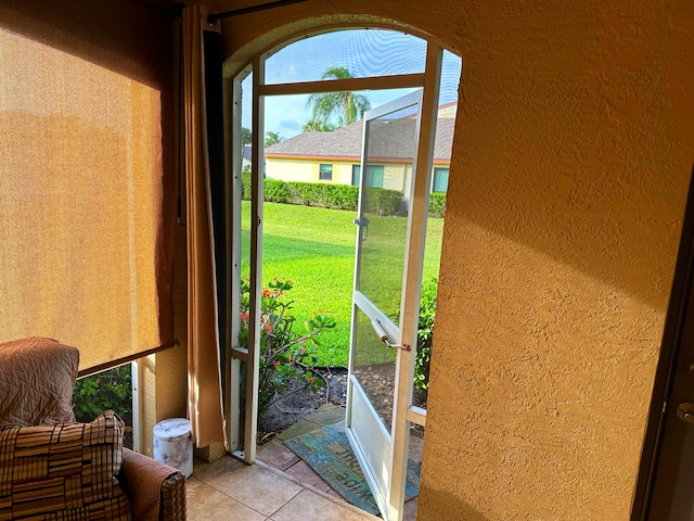 entryway with light tile patterned floors