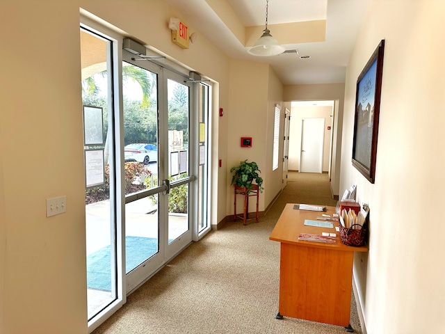 doorway featuring light carpet