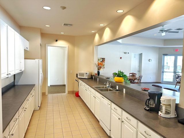 kitchen with white cabinetry, sink, ceiling fan, white appliances, and light tile patterned flooring