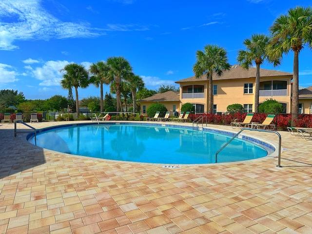 view of pool featuring a patio area