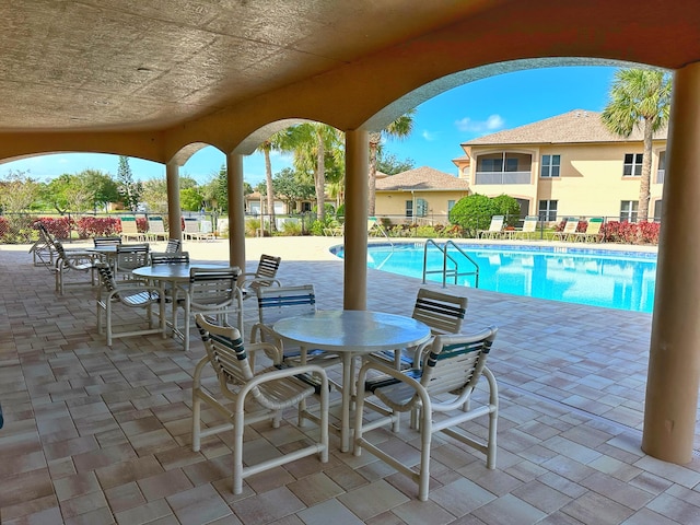 view of swimming pool featuring a patio area