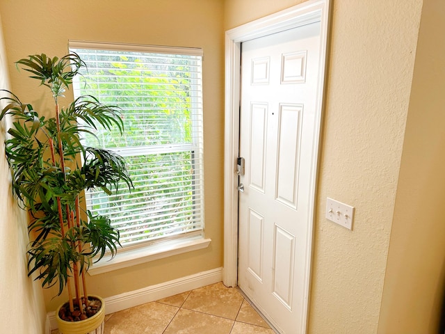 entryway featuring light tile patterned floors