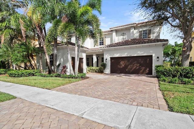 mediterranean / spanish house featuring a garage