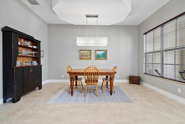 tiled dining space featuring a wall unit AC