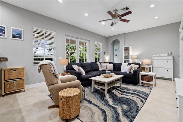 living room featuring ceiling fan and light tile patterned flooring