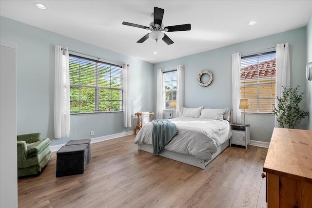 bedroom featuring ceiling fan and light hardwood / wood-style flooring