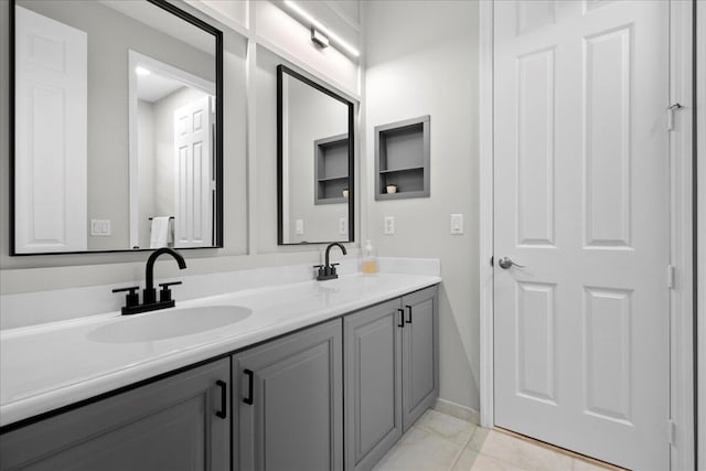 bathroom with tile patterned flooring and vanity