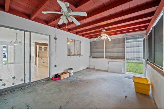 interior space featuring ceiling fan, beam ceiling, plenty of natural light, and wood ceiling