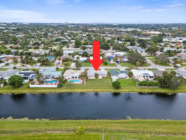 birds eye view of property with a water view