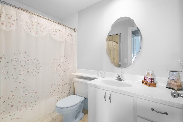 7770 SE Spicewood Cir, Hobe Sound, FL 33455 - bathroom with vanity, tile patterned flooring, toilet, and shower / bathtub combination with curtain