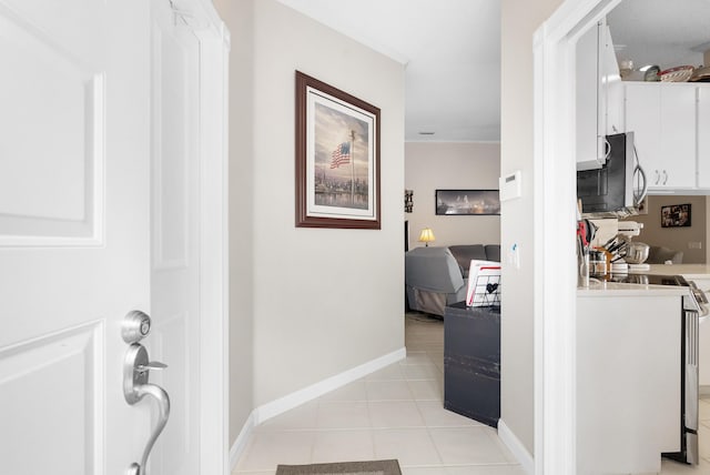 7770 SE Spicewood Cir, Hobe Sound, FL 33455 - corridor with light tile patterned floors and baseboards