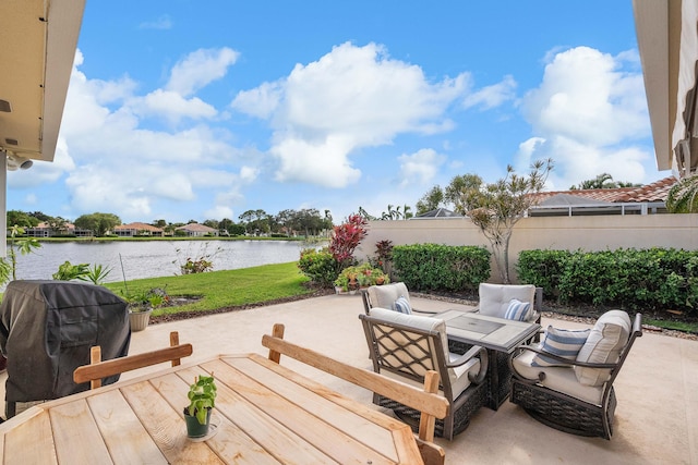 view of patio featuring a grill and a water view