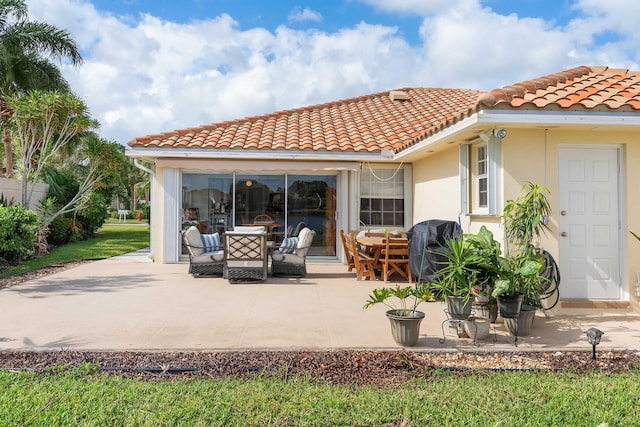 rear view of house with a patio area