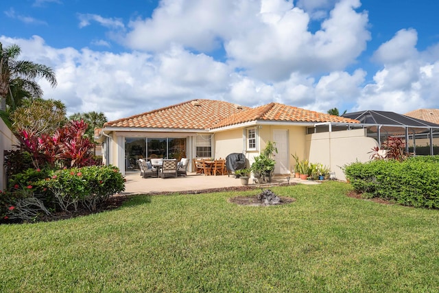 back of property featuring an outdoor living space, a patio area, a yard, and a lanai