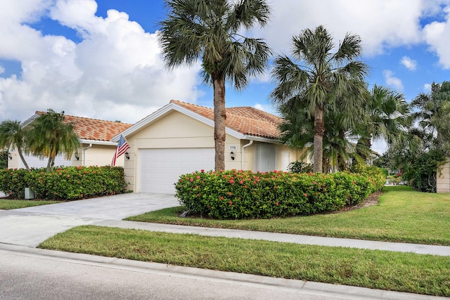 7770 SE Spicewood Cir, Hobe Sound, FL 33455 - view of front of house featuring a tile roof, a garage, stucco siding, a front yard, and driveway